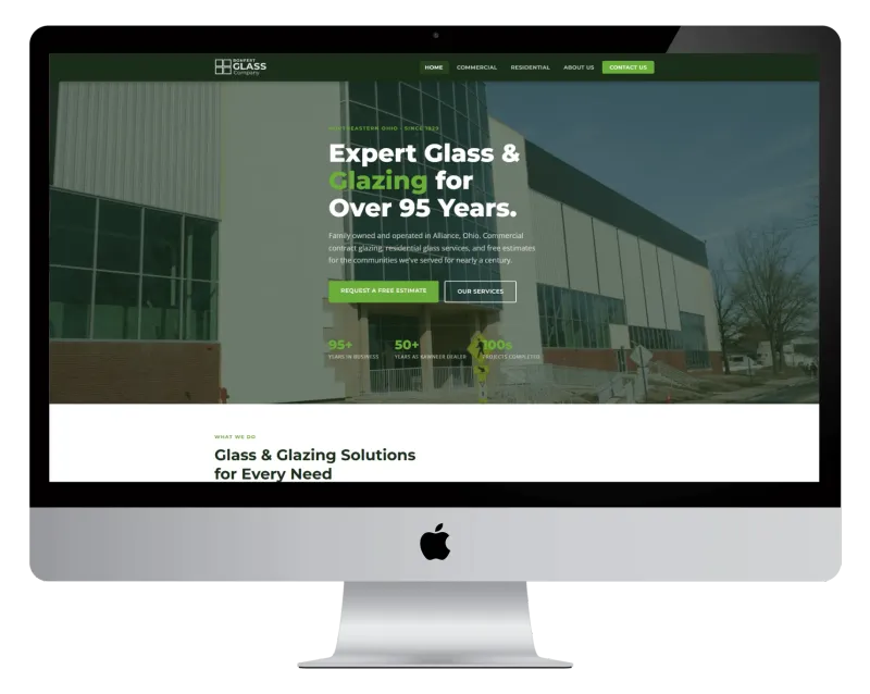 Bonfert Glass homepage on a desktop monitor, with a commercial building photo and a Request a Free Estimate button Bonfert Glass homepage on a desktop monitor, with a commercial building photo and a Request a Free Estimate button