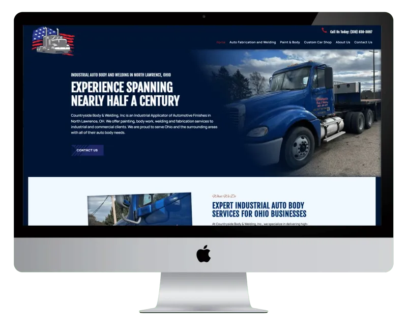 Countryside Body & Welding homepage on a desktop monitor, with a blue semi truck beside the headline Countryside Body & Welding homepage on a desktop monitor, with a blue semi truck beside the headline