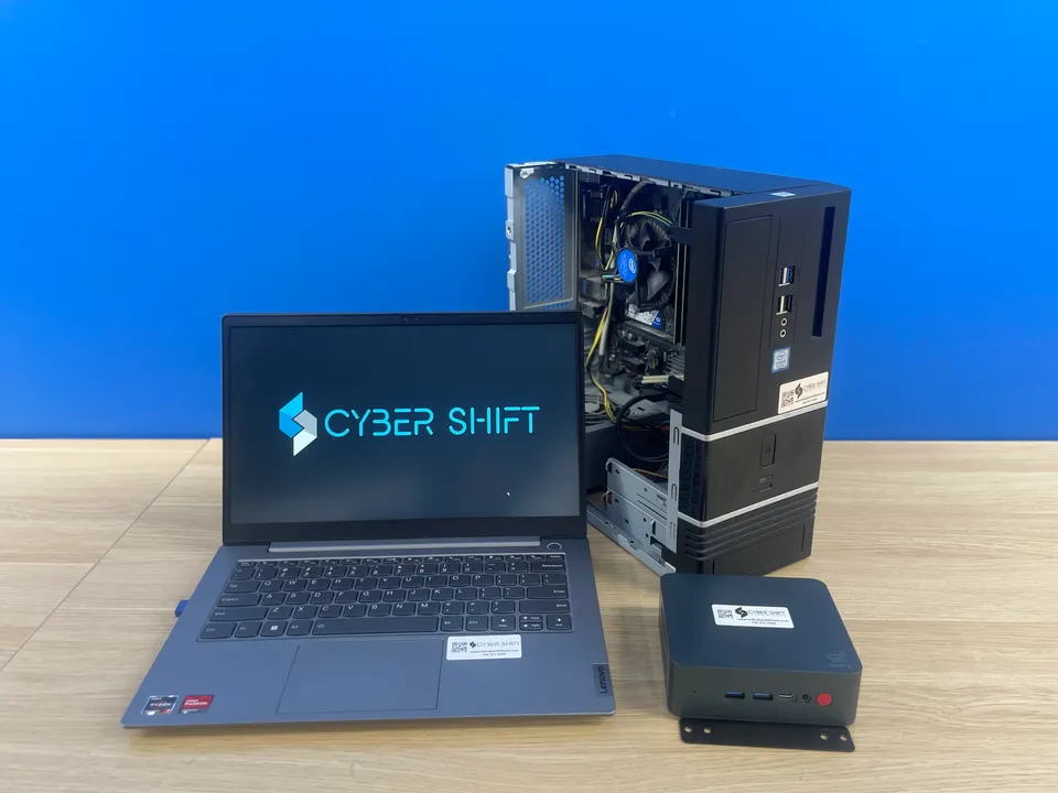 A laptop, desktop and compact PC with Cyber Shift branding A laptop, desktop and compact PC with Cyber Shift branding