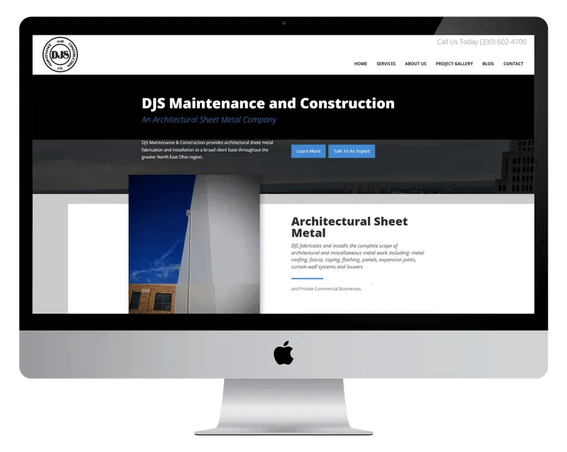 DJS Maintenance and Construction homepage on a desktop monitor, with architectural sheet metal on a building exterior DJS Maintenance and Construction homepage on a desktop monitor, with architectural sheet metal on a building exterior