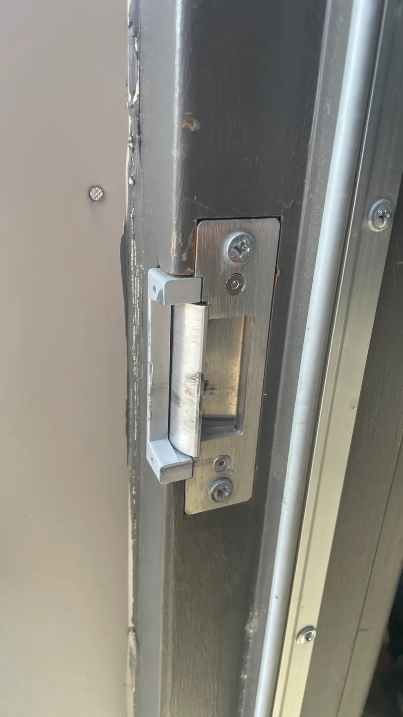 An electric strike fitted to a door frame
