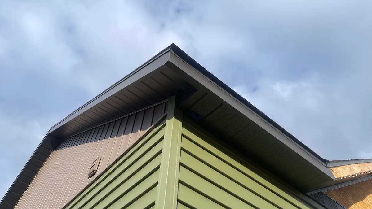 An exterior camera fitted beneath a building roofline An exterior camera fitted beneath a building roofline