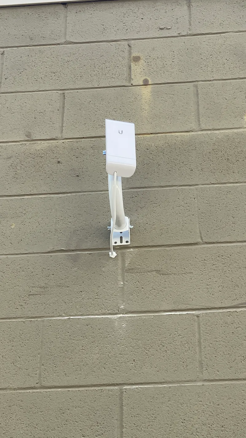 A wall-mounted outdoor wireless unit A wall-mounted outdoor wireless unit