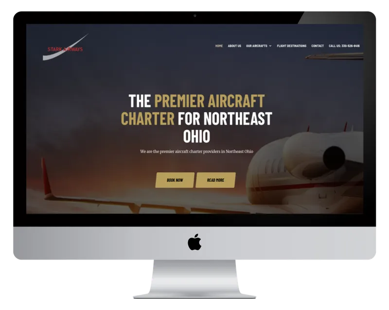 Stark Airways homepage on a desktop monitor, with a private jet at sunset Stark Airways homepage on a desktop monitor, with a private jet at sunset